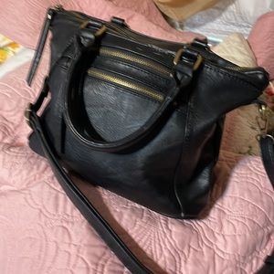 Madison West women’s handbag.   10” by 13”, 7 pockets;organized. Handles& strap